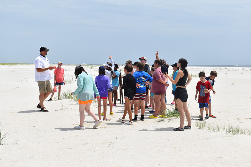 MSU faculty teaching students on the beach
